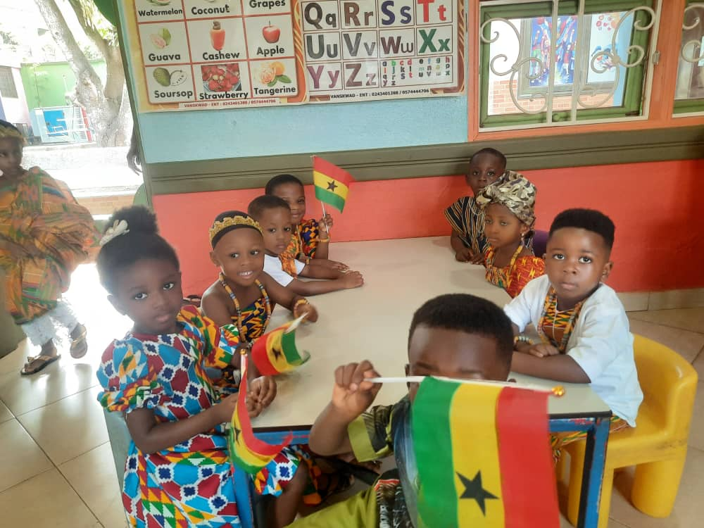 Nursery class celebrating with Ghana flags
